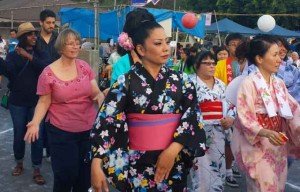 a woman in a colorful outfit dancing