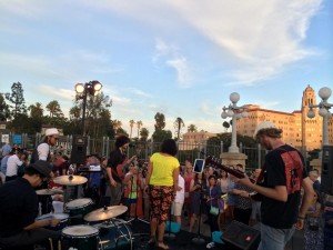 Musicians on stage in front of a crowd