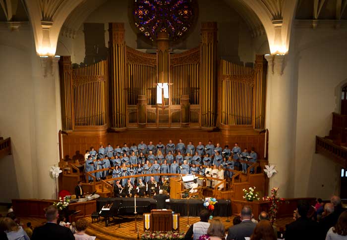 a choir singing in a sanctuary