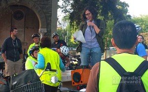 a woman speaking on a hand held microphone