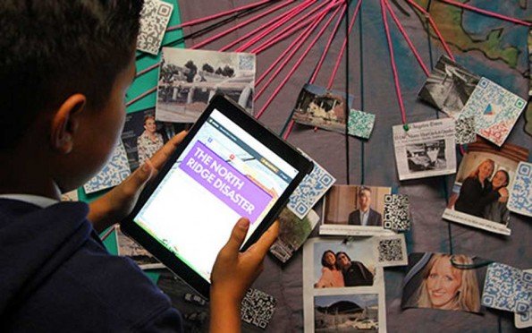 a hand holding a tablet