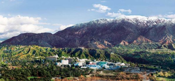 a spraawliing set of buildings under the san gabriel mountains