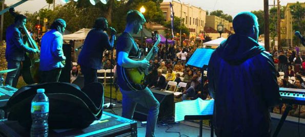 a band playing and people dancing