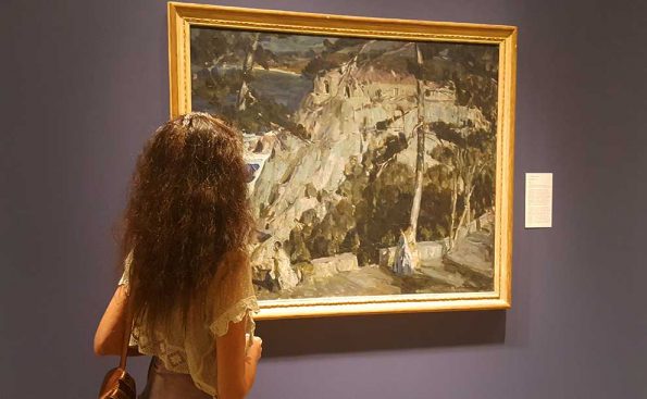 Toti O'Brien admiring "Summer Night" painting by E. Charlton Fortune at PMCA (Photo - Staff).