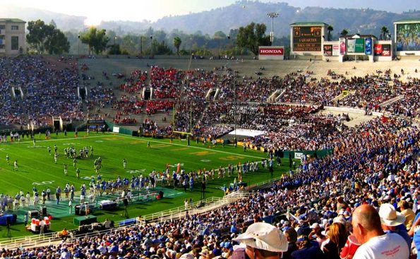 A crowd in a stadium on a sunny day