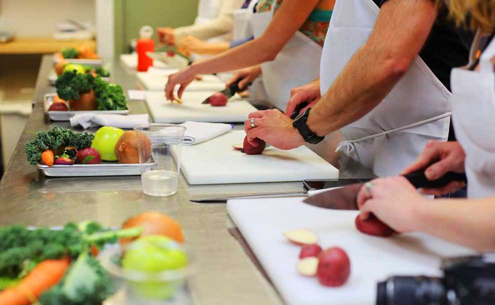people cutting vegetables