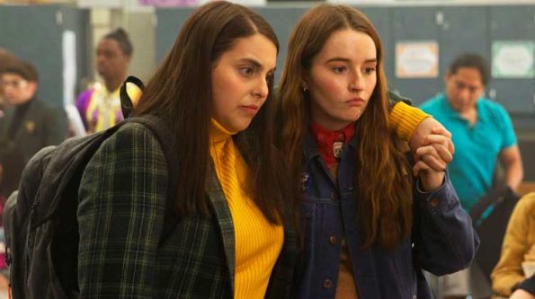 two high school age girls look distraught