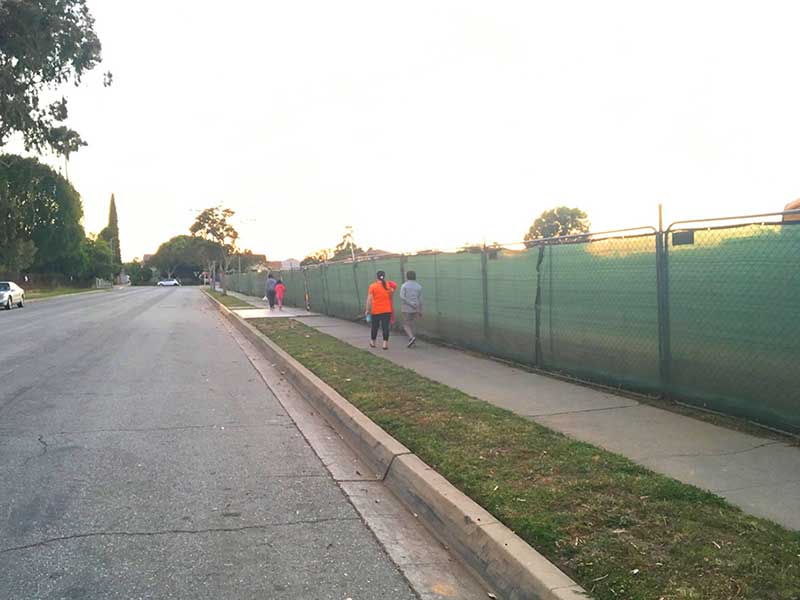 An After photo of a bare street and no trees