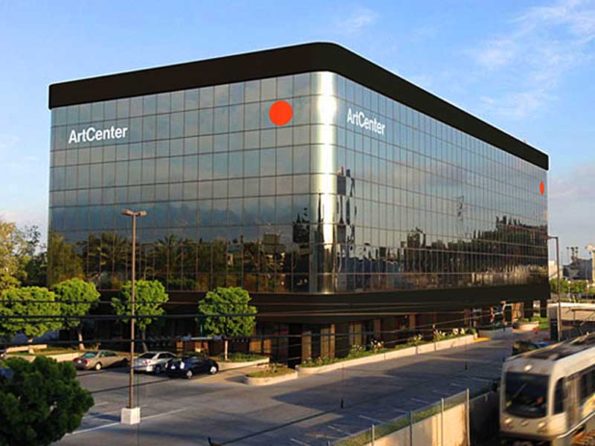 A square building with an orange dot signifying artcenter logo