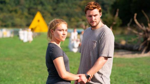 A man and a woman on a field in the hot summer