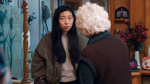 a white haired woman talking to an asian girl