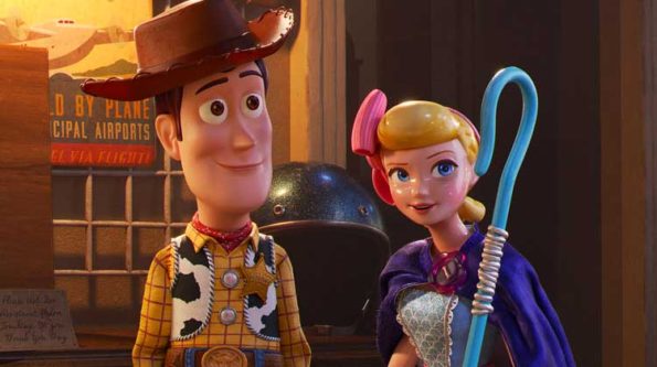 a toy in a cowboy hat and a female toy with a pink bowtie