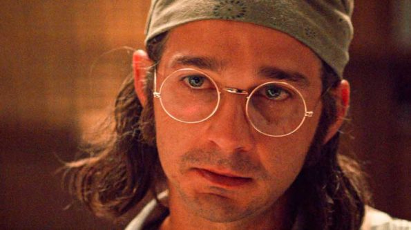 A man with glasses and a bandana