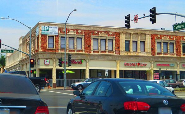 A historical building with cars on the street