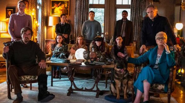 a group of people all looking worried gathering in one room