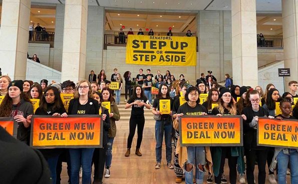 students holding climate signs