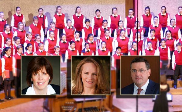 A photo of 2 women and one man with children choir behind them