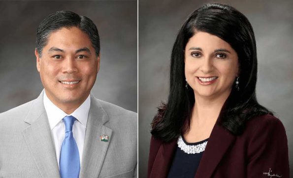 A man and a woman smiling at camera