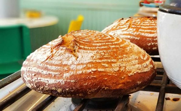 A crusty orange colored bread with white wrinkles