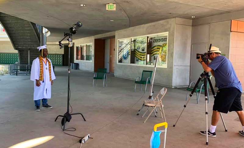 A student having his photo taken 6 feet away