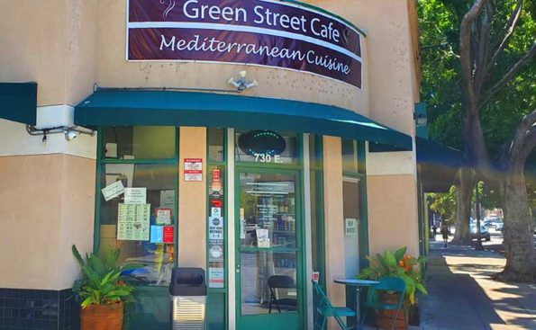 A restaurant front with a sidewalk