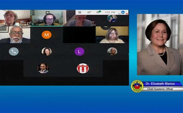 A virtual meeting with boxes of people and a main speaker photo on the right side