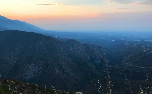 purpulish haze in the sky above the mountains
