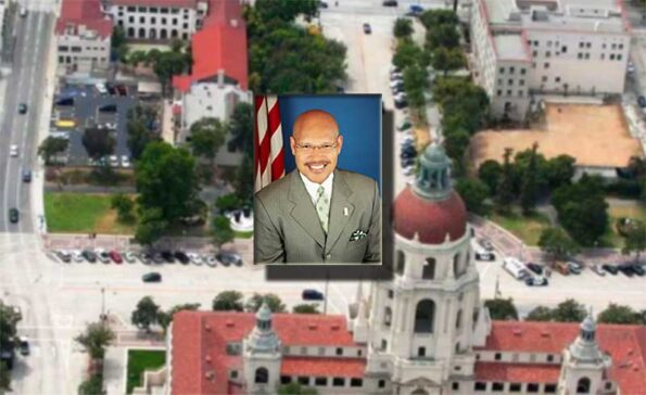 city view with photo in between of an African American person with glasses