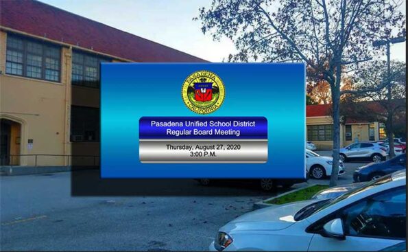 A building with graphics announcing a meeting