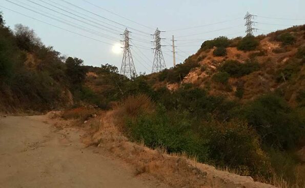 a moon over power lines