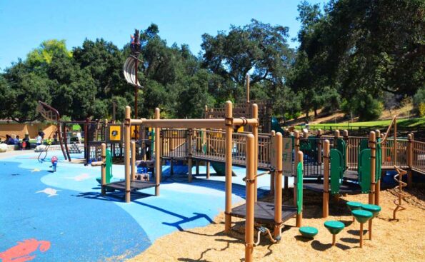 kids playground with blue floors and wooden structures