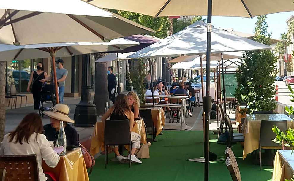 people dining under a tent
