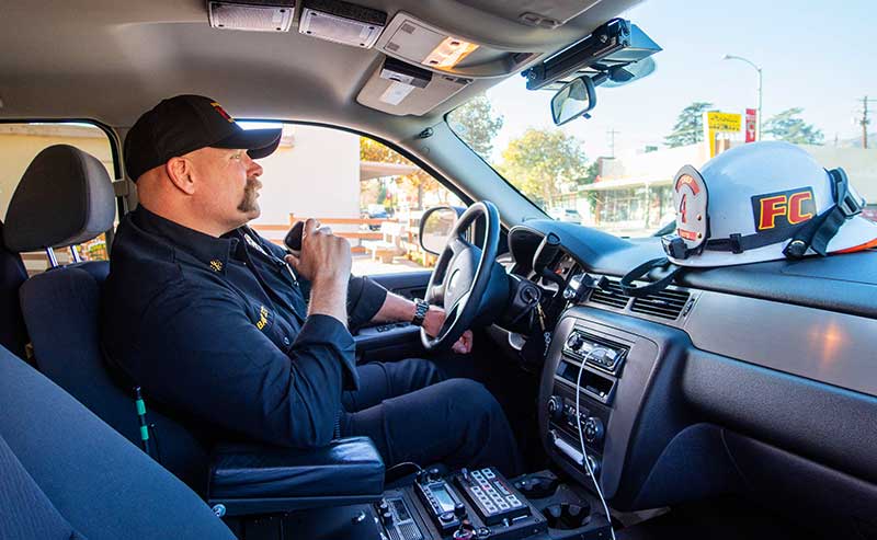 a man behind teh wheels of a truck
