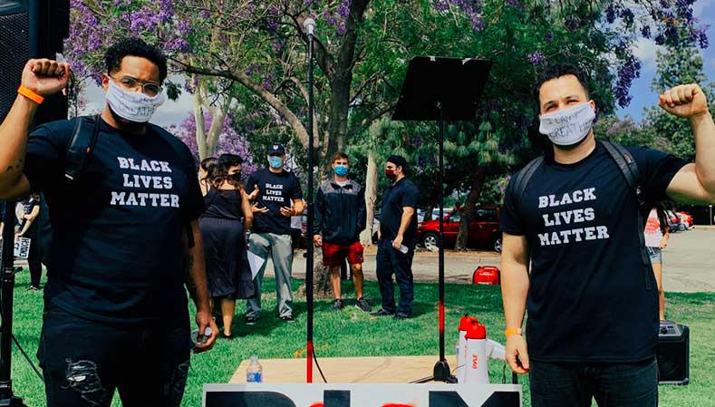 two guys raising their fists