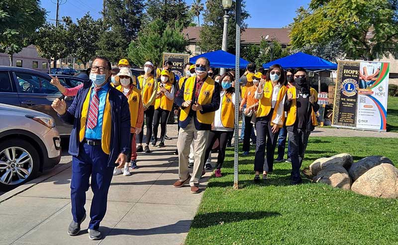 People in yellow jackets walking on the street