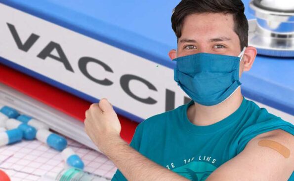 a guy with his arm extended to show vaccination