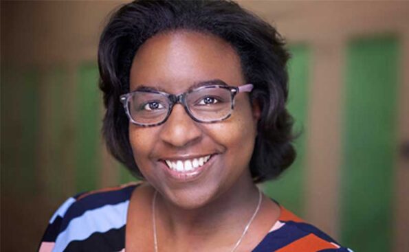 A clak woman with glasses