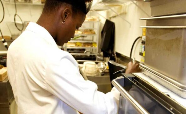 a person inspecting food