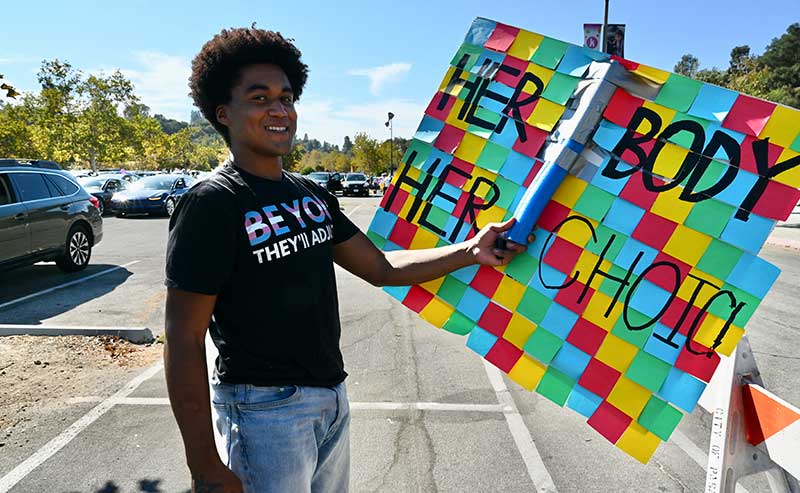 A person holding a sign