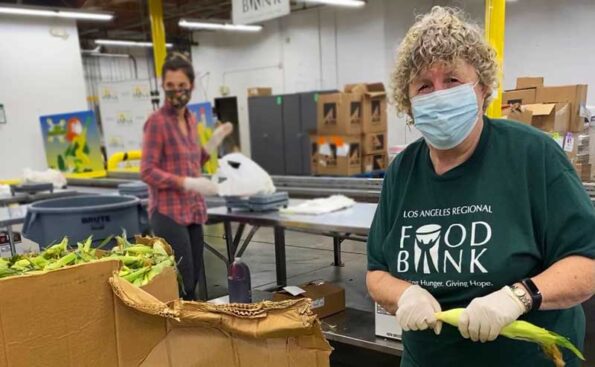 a woman helping in a kitchen