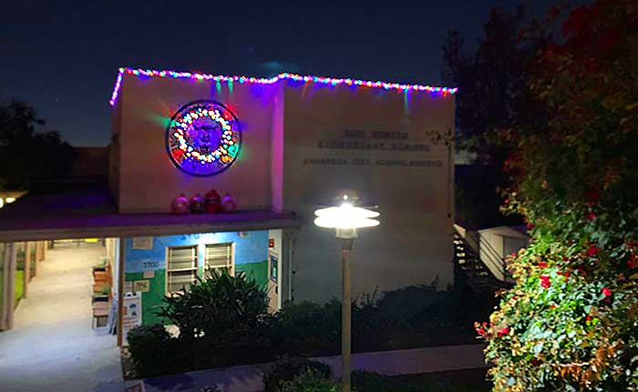 a building lit with Holiday lights at night