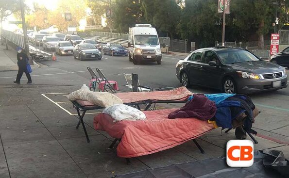 two beds on a sidewalk