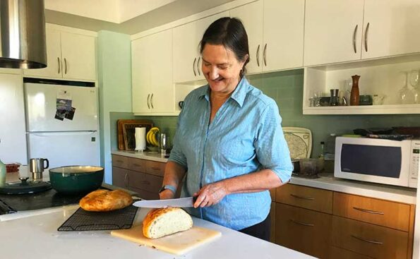 a woman slicing bread