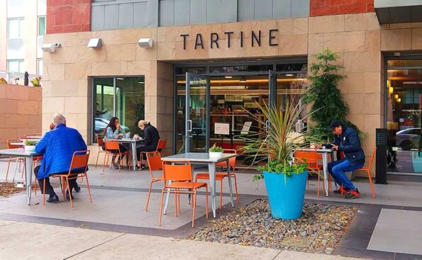 outside a bakery with chairs and tables