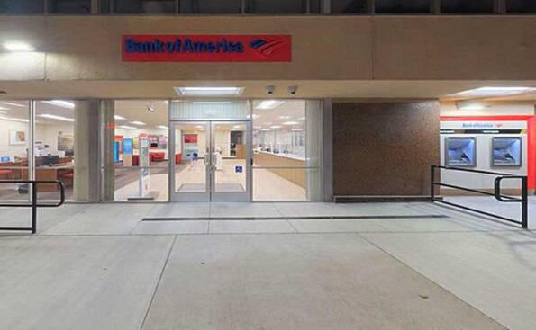 A former bank building lit at night