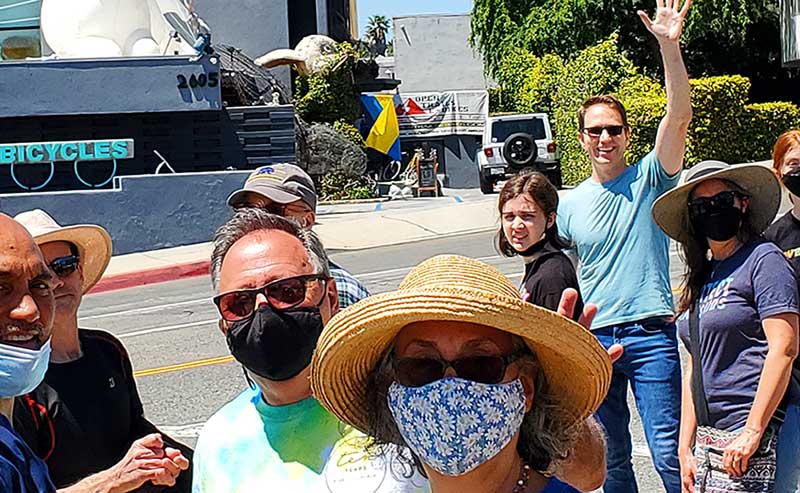 People waving at camera