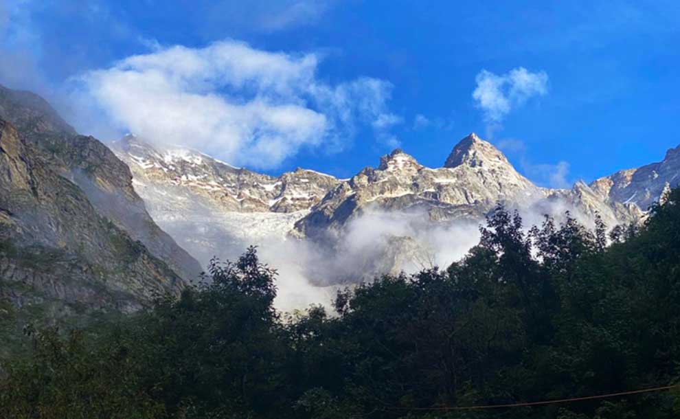 steep mountains and clouds beneath them