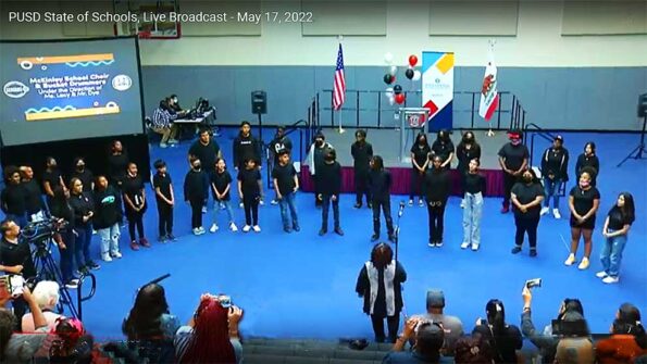 Students performing on stage