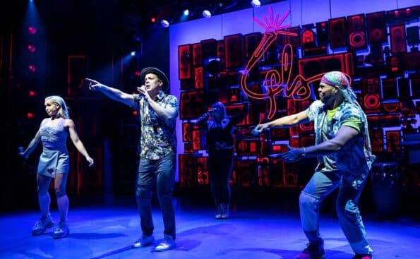 four individuals performing on stage