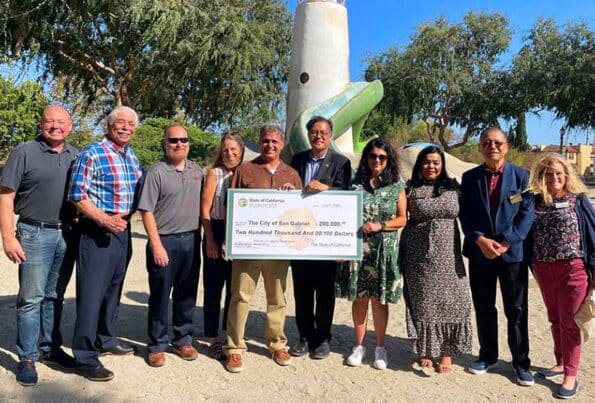 People holding an oversized check